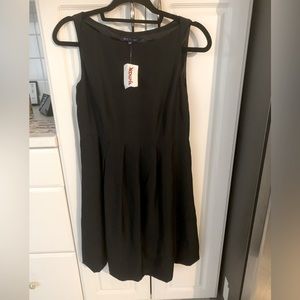 Black 100% silk cocktail dress. Never worn. Size 4